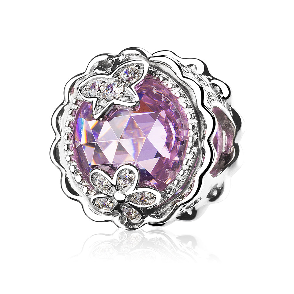 Front view of sparkling butterfly flower charm in pink CZ on white background