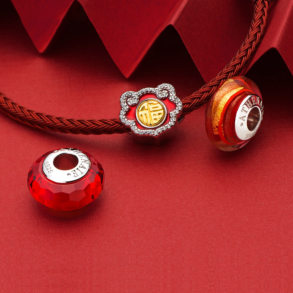 Golden Flame Murano glass charm bead displayed in elegant jewelry setting