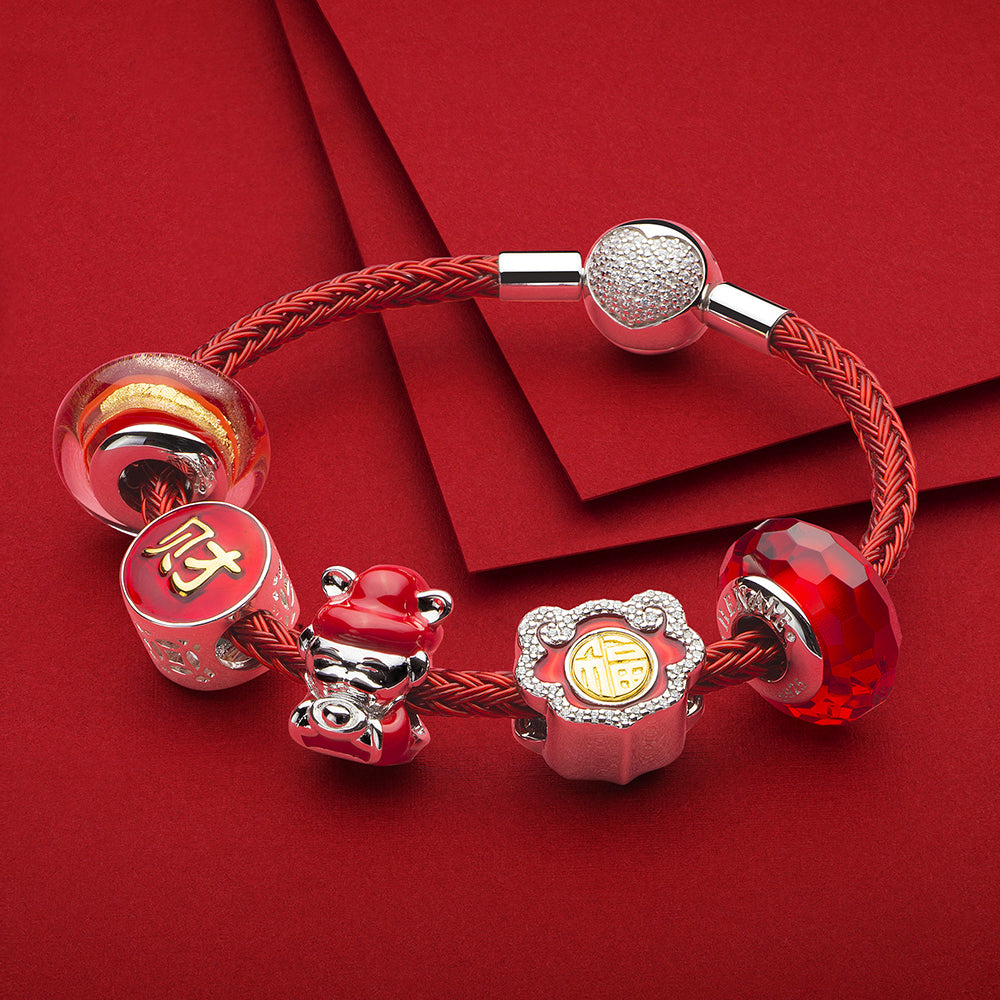 Golden Flame Murano glass charm paired with silver bracelet and charms