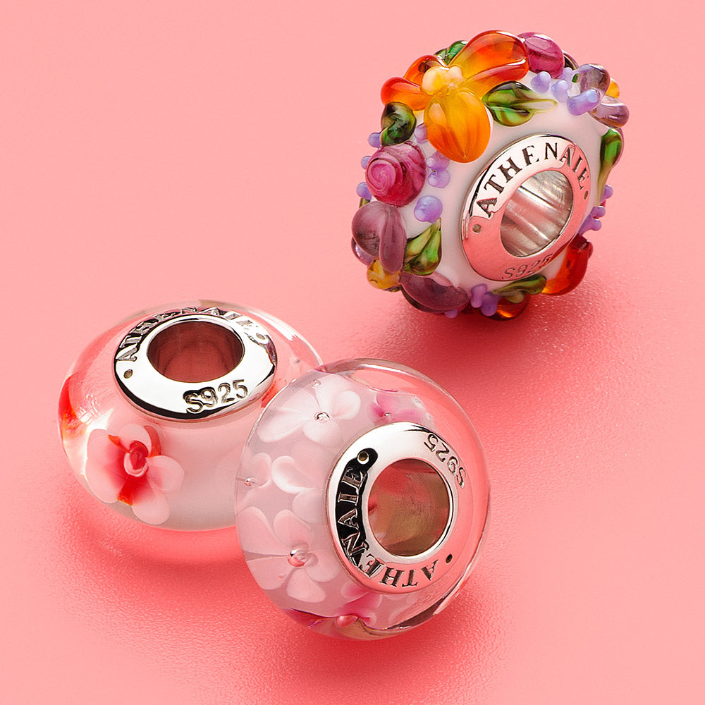 Romantic cherry blossom charm paired with silver beads