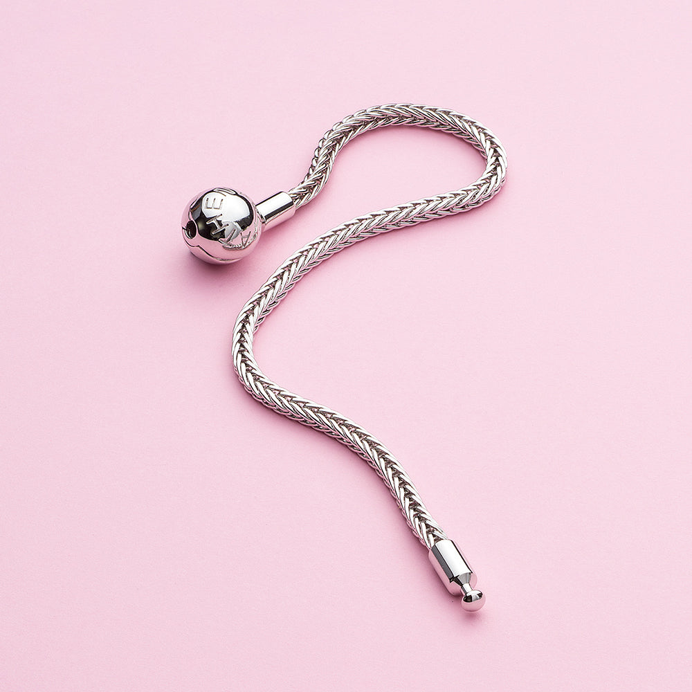 Close-up of 925 silver wheat bracelet with smooth snake chain