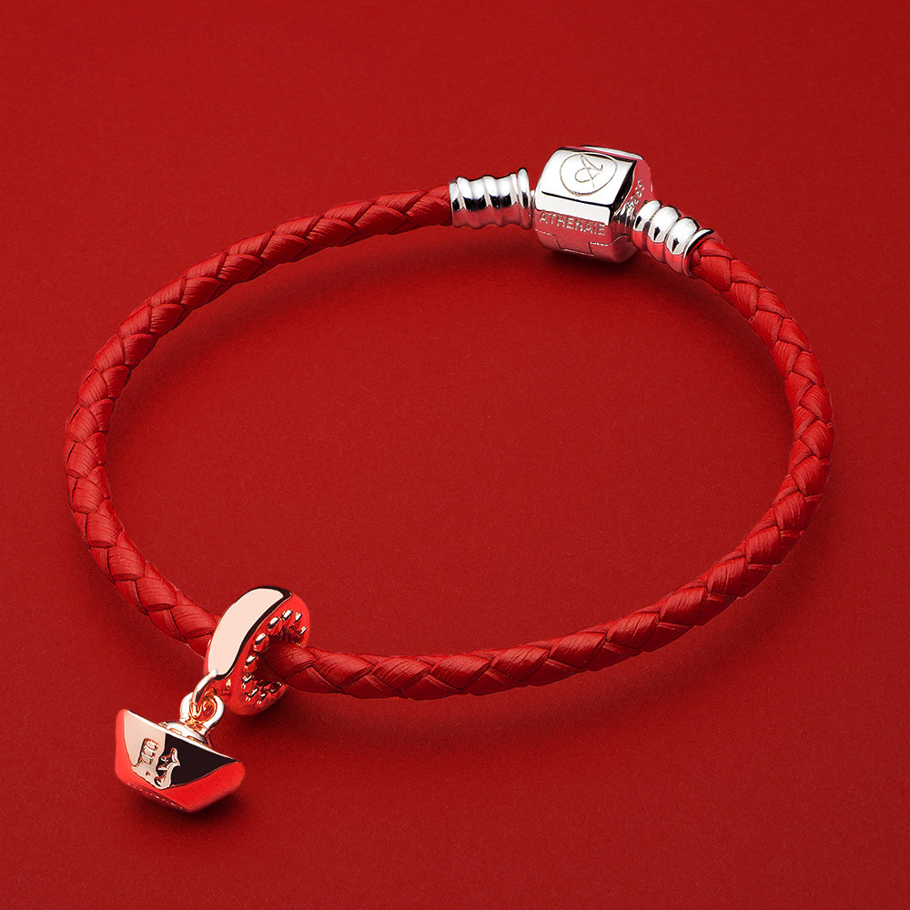 Rose gold Chinese ingot charm paired with red leather charm bracelet