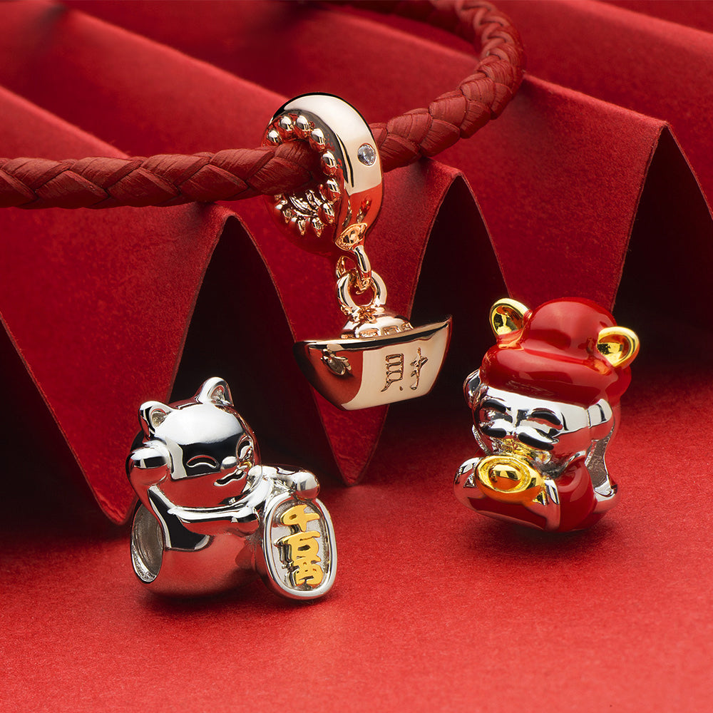 Chinese New Year style rose gold Yuan Bao charm with festive setup