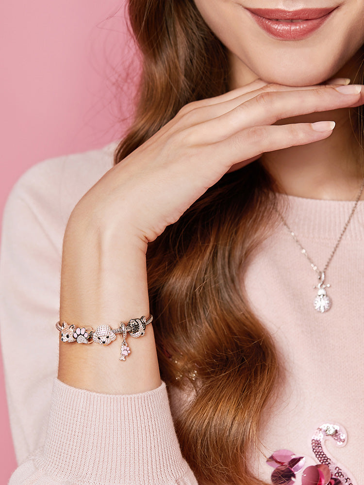 Model wearing akita dog charm bracelet with sparkling CZ
