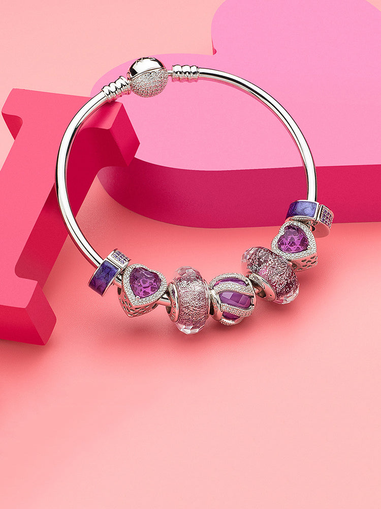 Amethyst clip stopper charm styled with silver snake chain bracelet