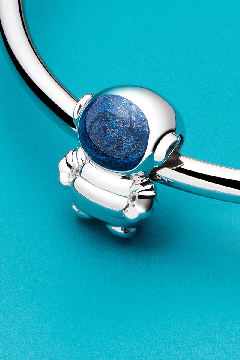 Astronaut charm bead styled on bracelet by ATHENAIE