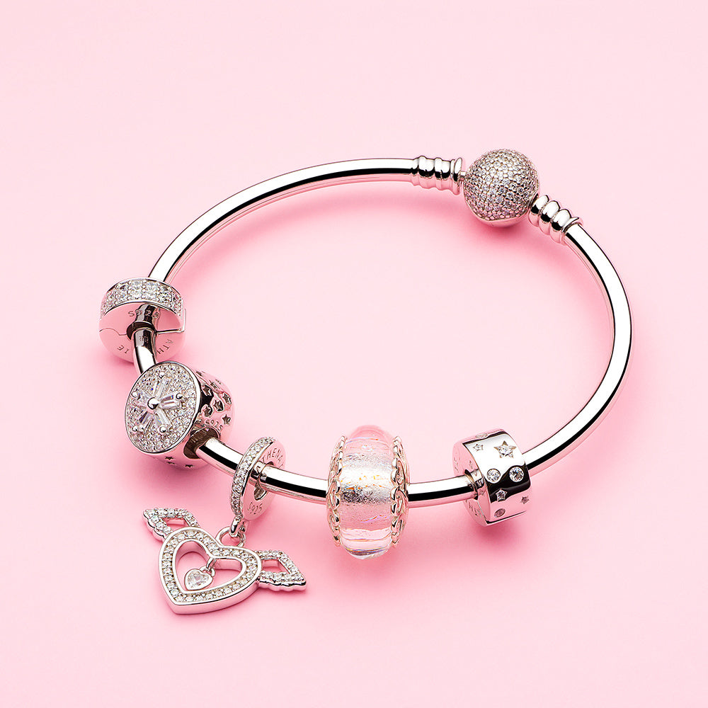 Angel of Love wing charm paired with sterling silver bracelet – ATHENAIE styling inspiration