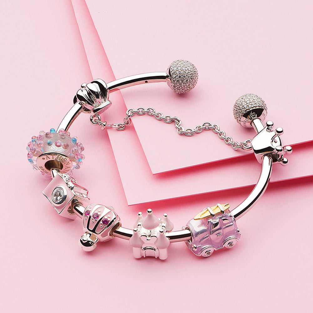 ATHENAIE Blush Balloon Charm Bead paired with silver bracelet – styling option 1