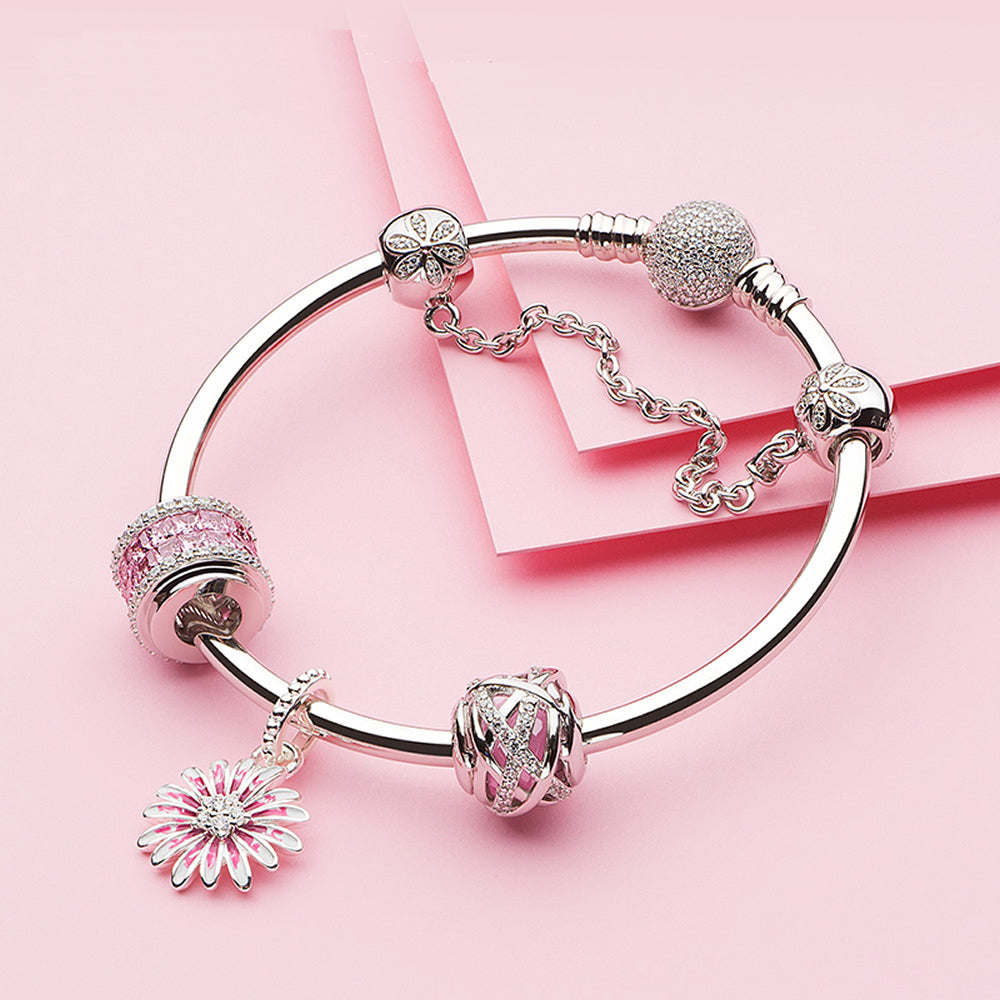 ATHENAIE Blush Column charm styled with silver bracelet – elegant wristwear for women