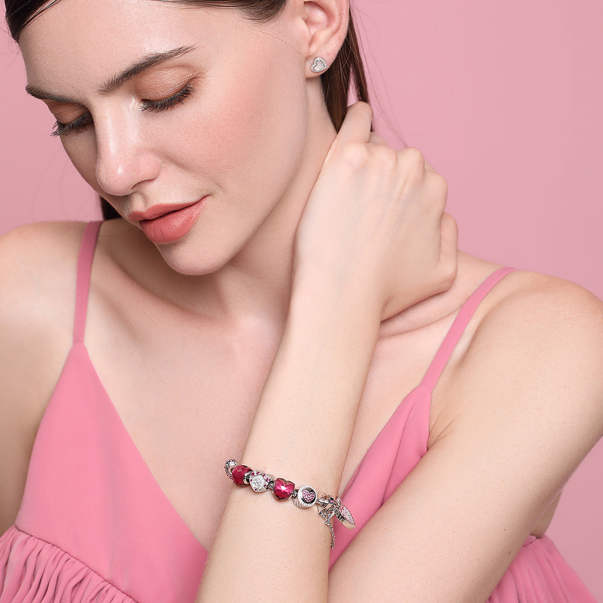 Close-up of model wearing Eternal Rose charm 925 silver rose bead with CZ