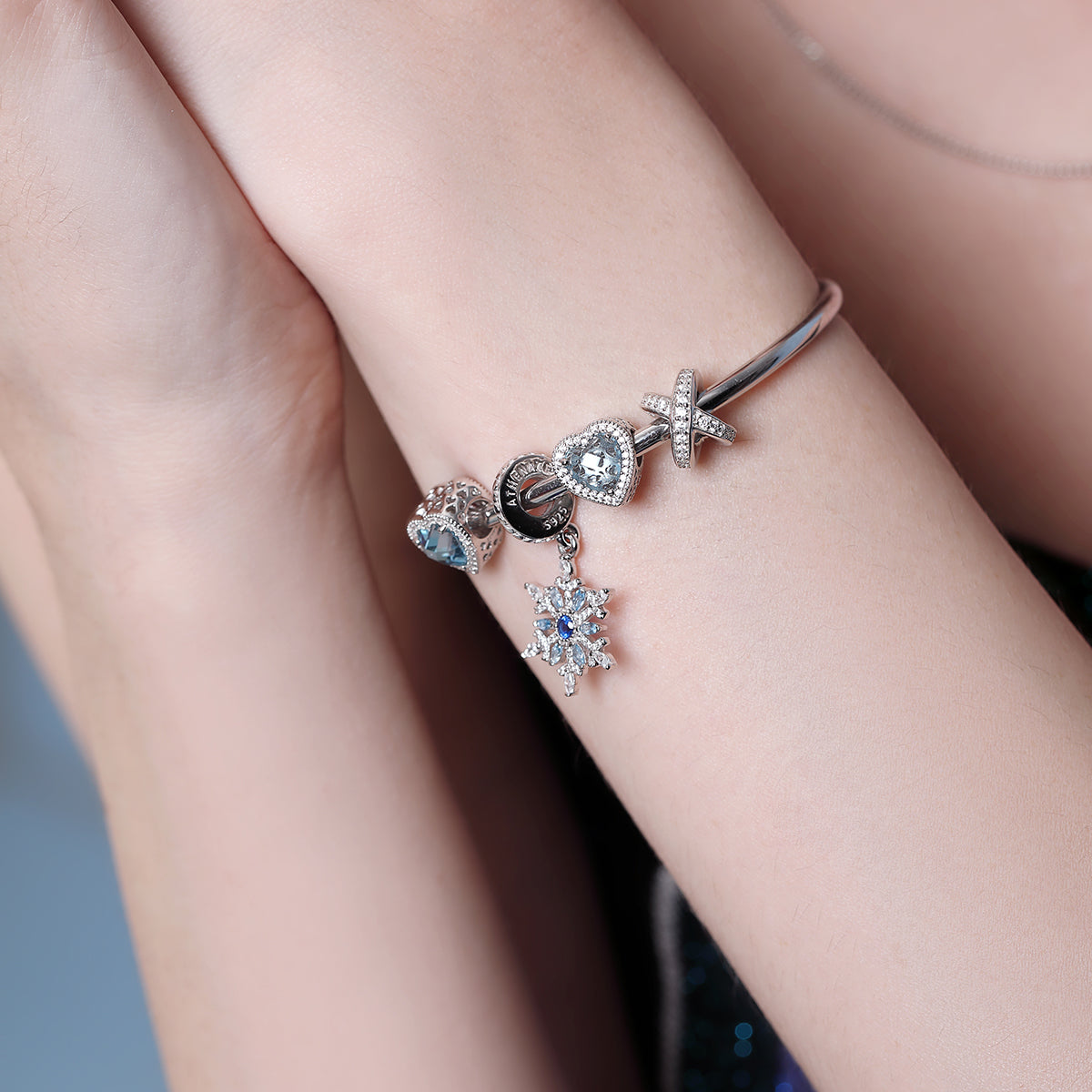 ATHENAIE Infinity Spark Charm Bead – model wearing elegant 925 silver bracelet charm