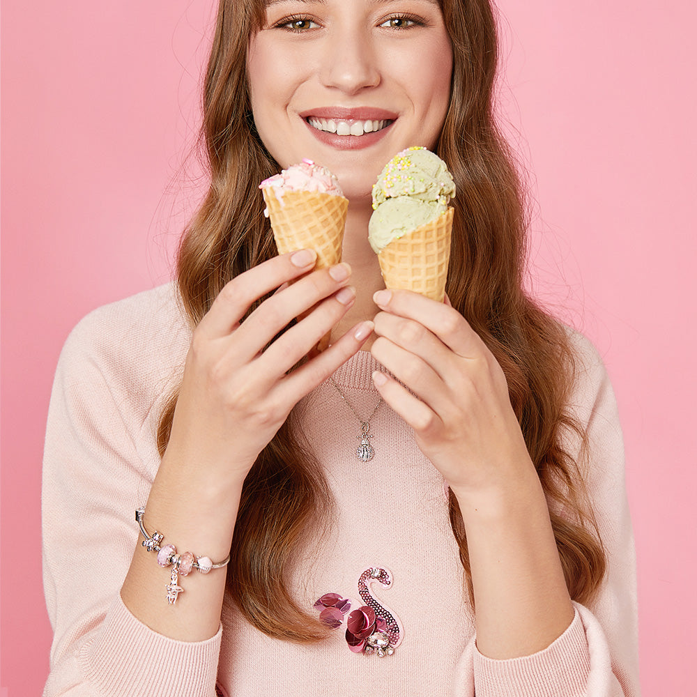 ATHENAIE sterling silver cupcake charm on model wrist
