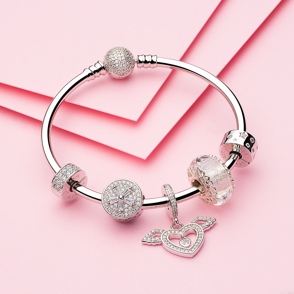 ATHENAIE Angel of Love wing charm – bracelet layering inspiration for charm lovers