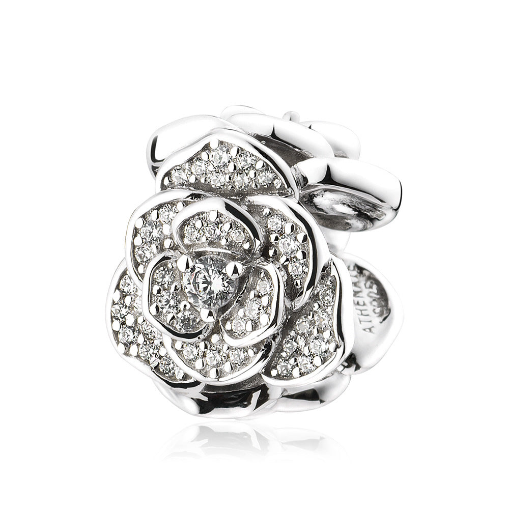 Sterling silver Rose Cluster charm on bracelet, lifestyle background view