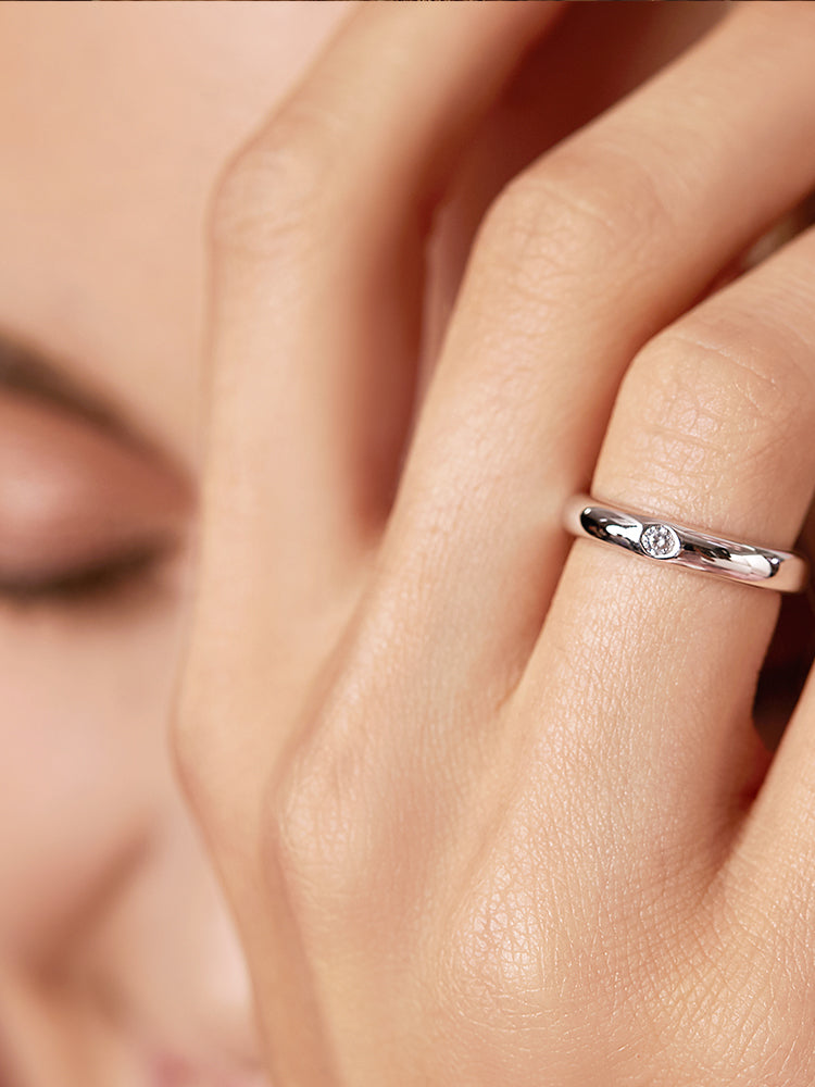 Sterling silver bezel CZ minimalist ring worn on hand