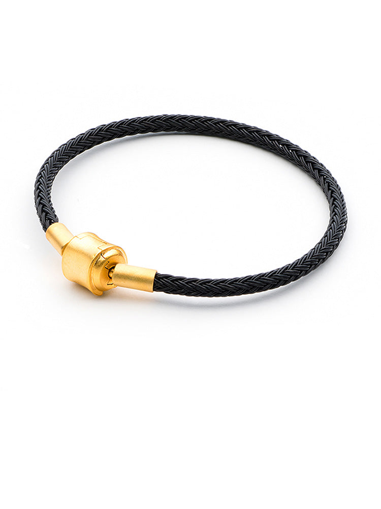 Black braided charm bracelet with gold clasp front view