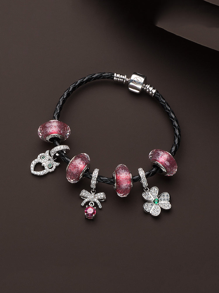 Black leather charm bracelet styled with charm beads