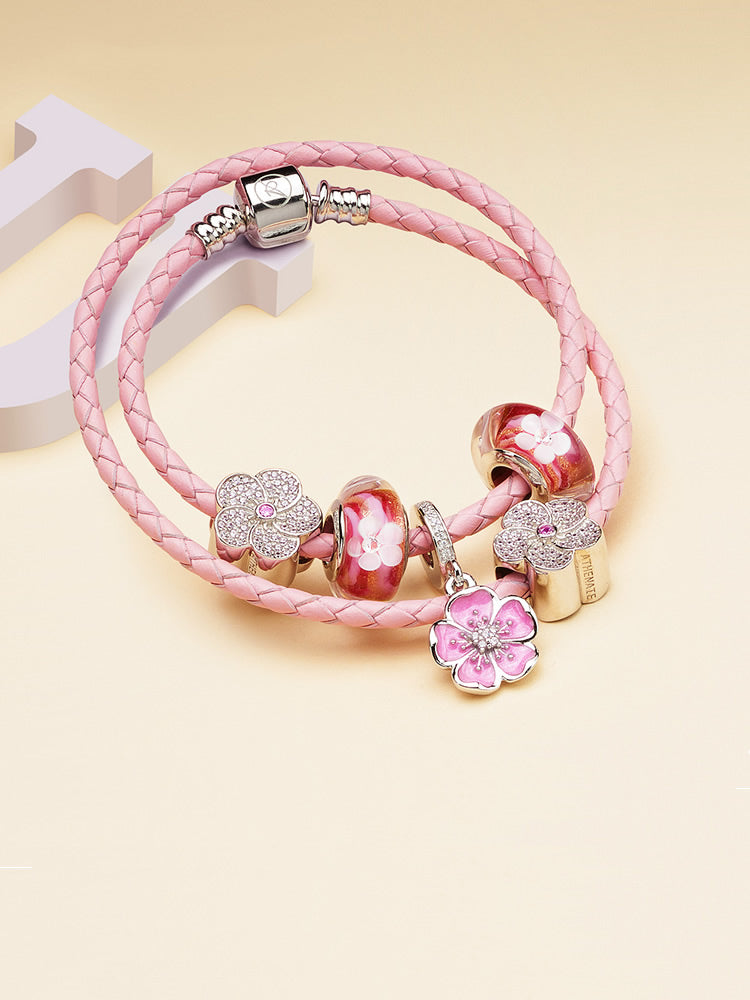 Blooming kiss murano glass charm paired with sterling silver charm bracelet