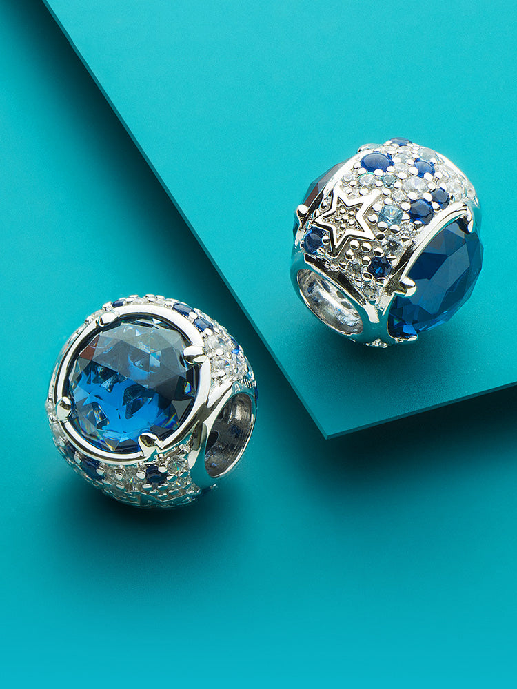 Blue radiance charm bead styled on bracelet by ATHENAIE