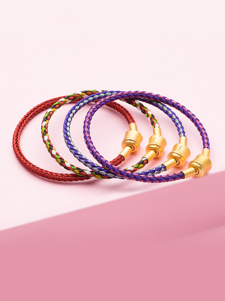 Blue purple braided charm bracelet styled with charm beads