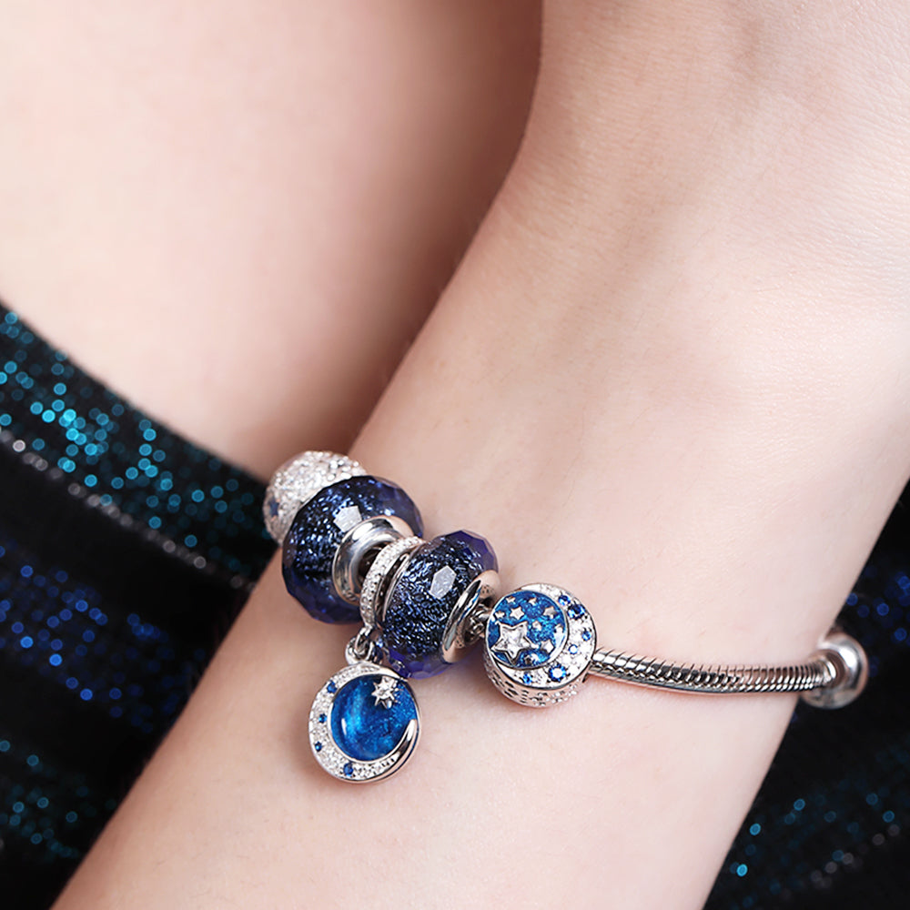 Close-up of Blue Radiance Murano glass charm on model wrist – sparkling glass and silver bead