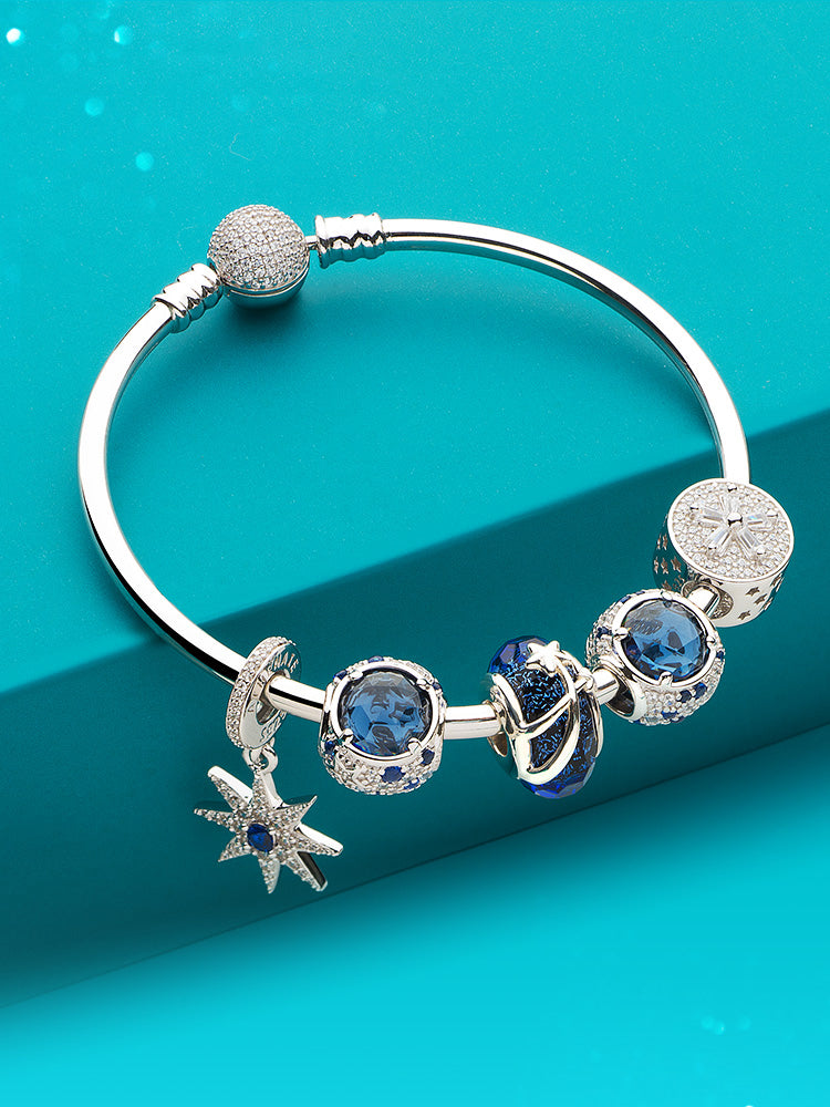 Blue charm bead styled with bracelet charms by ATHENAIE