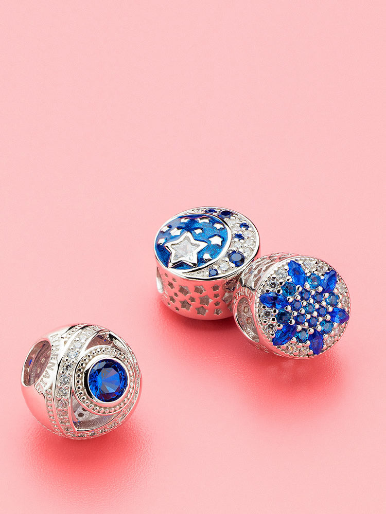 Blue snowflake charm bead styled on bracelet by ATHENAIE