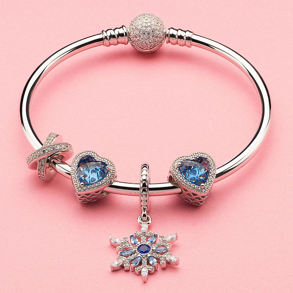 Blue Snowflake pendant charm styled with ATHENAIE silver bracelet – elegant holiday jewelry look