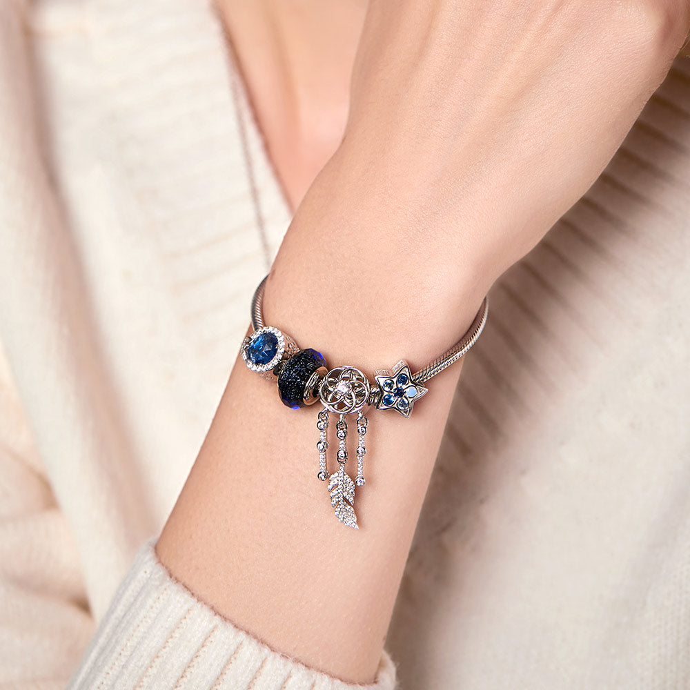 Close-up of Blue Star charm worn by model – 925 silver and CZ star bead