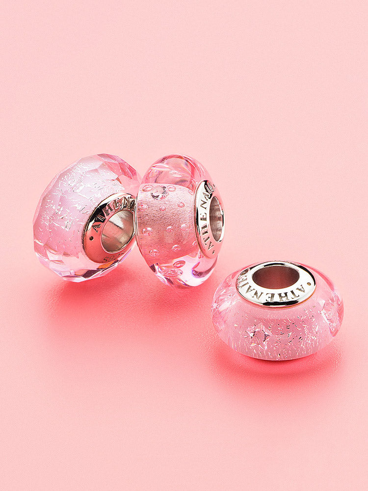 Blush dewdrops murano glass charm styled on sterling silver charm bracelet