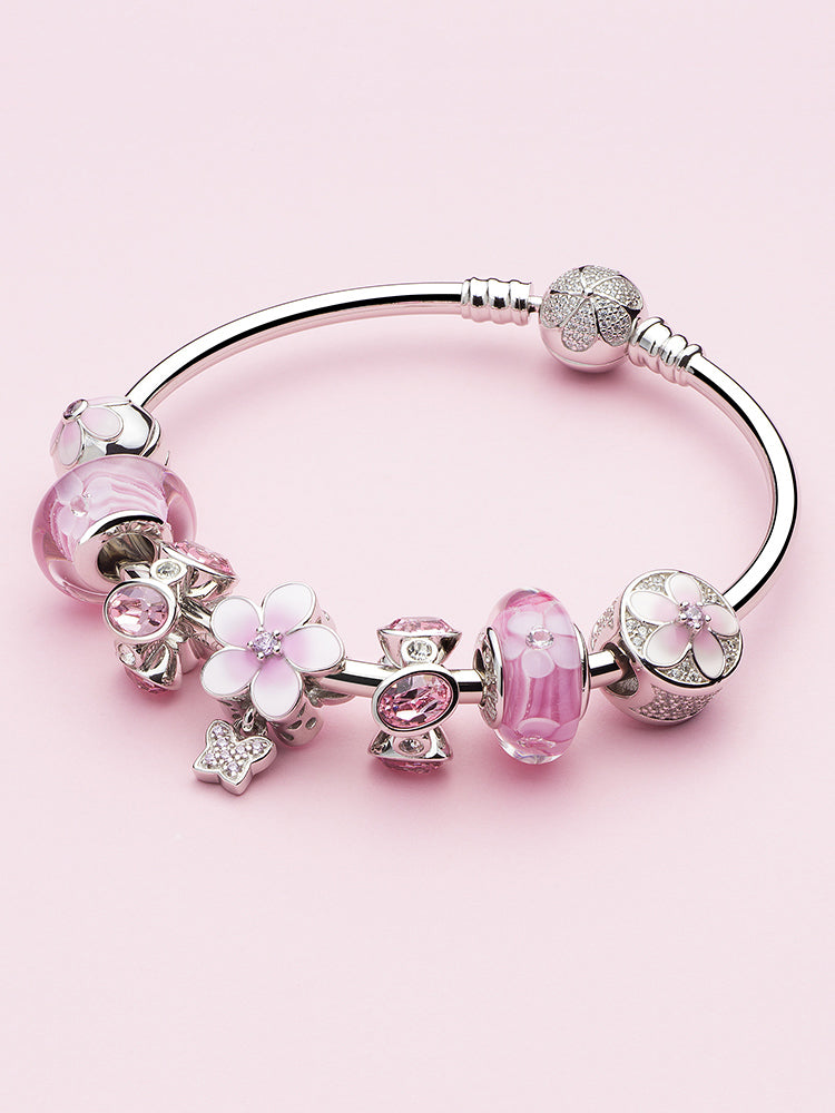 Blush elegance CZ charm bead paired with sterling silver charm bracelet