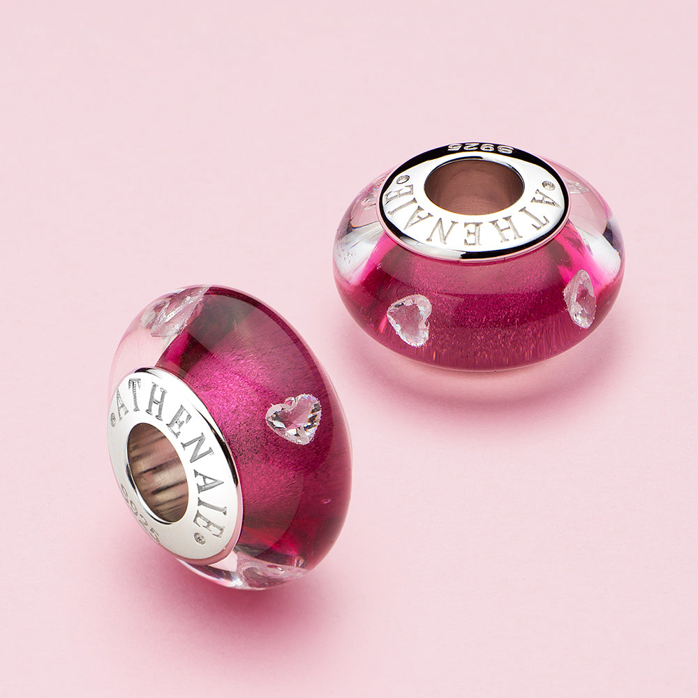 Blush Heart Murano glass charm bead displayed in a romantic scene.