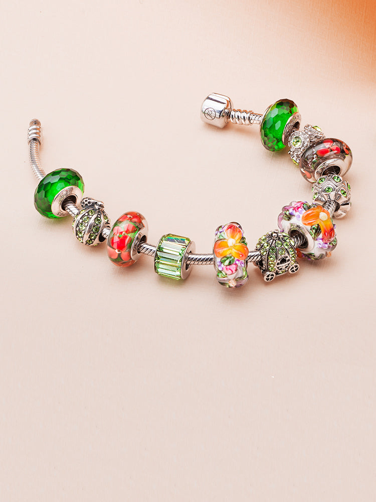 Bohemian floral Murano glass charm bead styled on bracelet with other charms