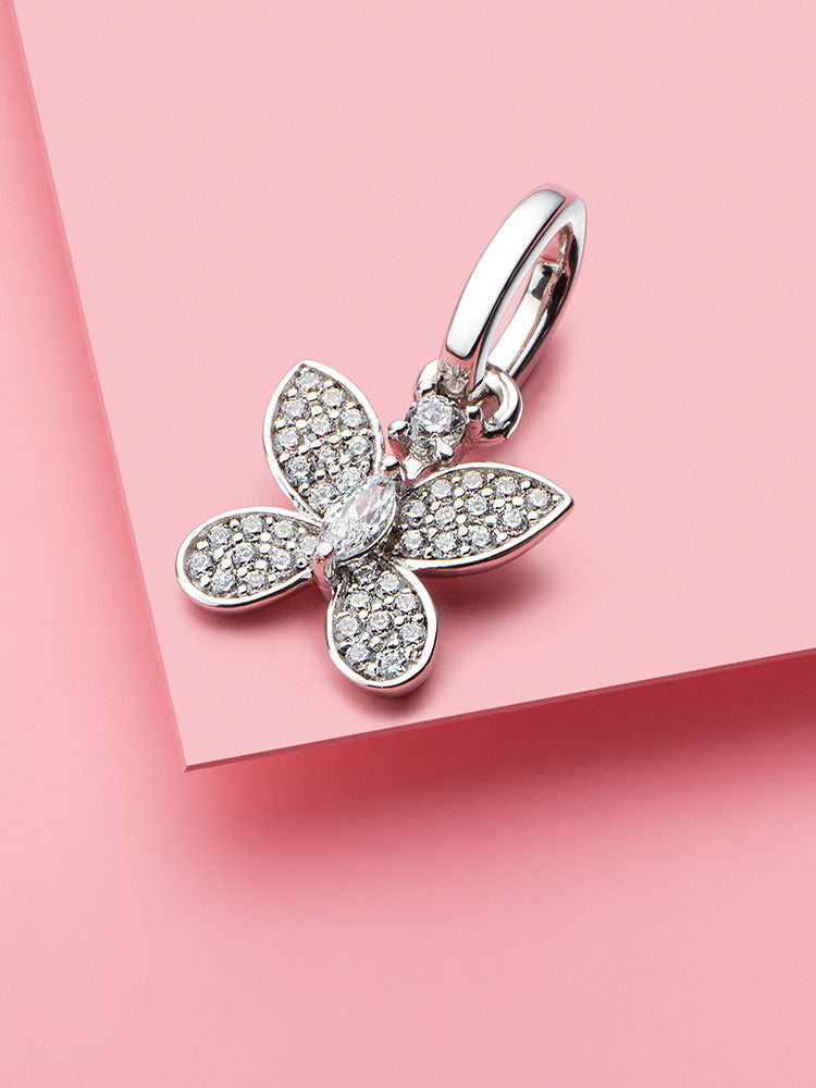 Sparkling butterfly dangle charm styled on bracelet