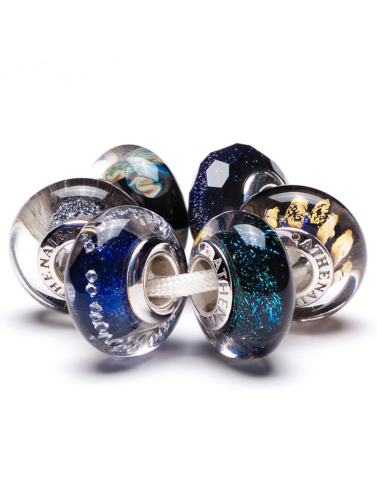 Celestial driftmist murano glass charm paired with sterling silver charm bracelet