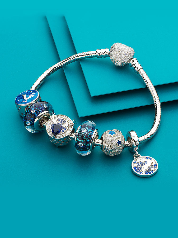 Celestial star charm bead on sterling silver charm bracelet