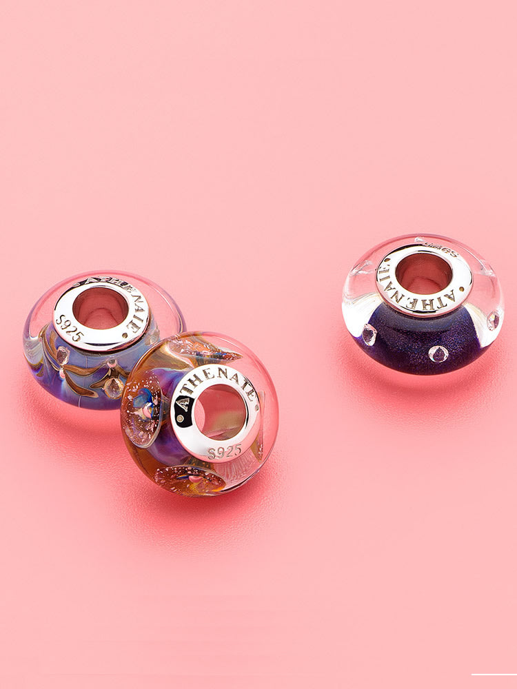 Celestial stream murano glass charm styled on sterling silver charm bracelet