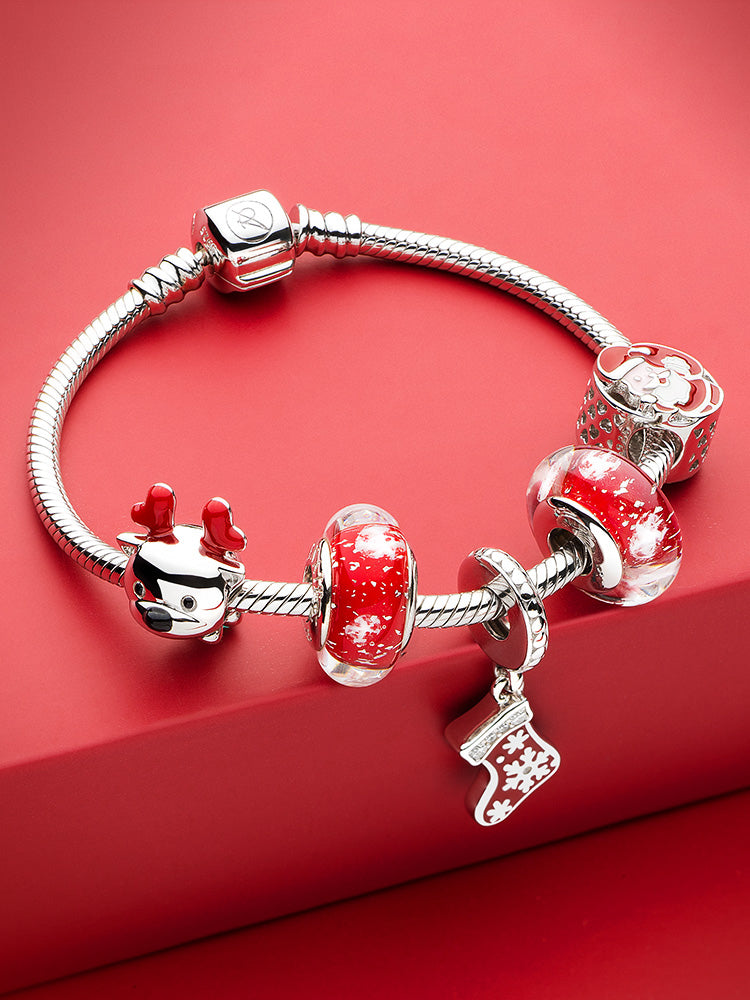 Christmas stocking pendant charm paired with charm bracelet