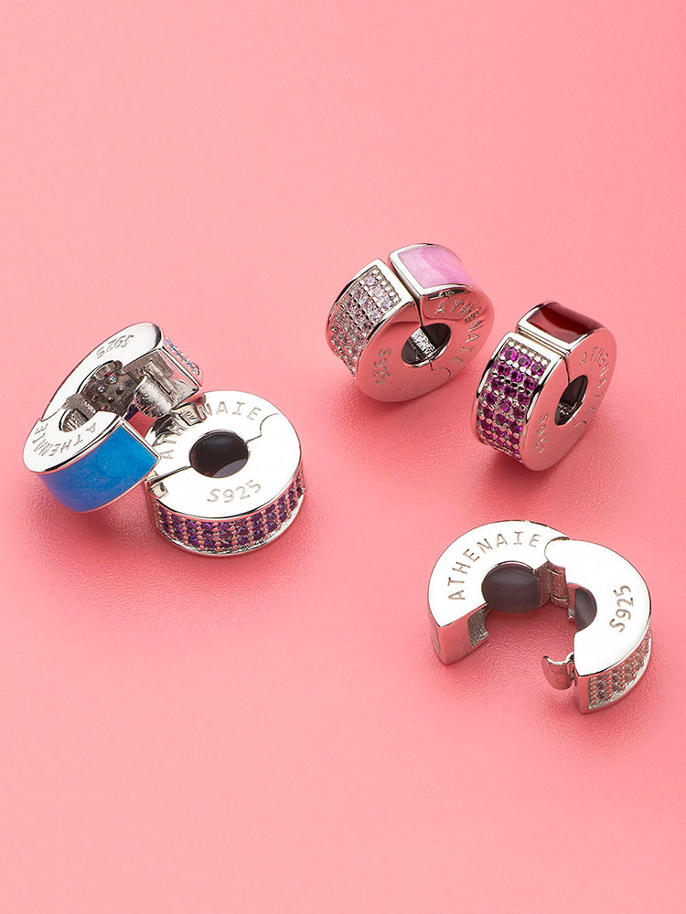 Crystal clip stopper charm positioned between charms on European bracelet