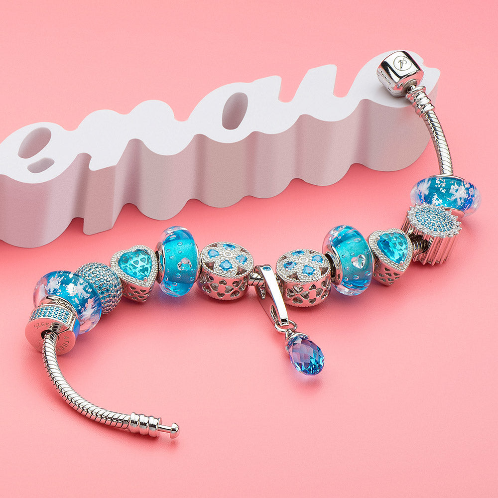 Crystal Snowflake Murano glass charm bead styled on silver bracelet.