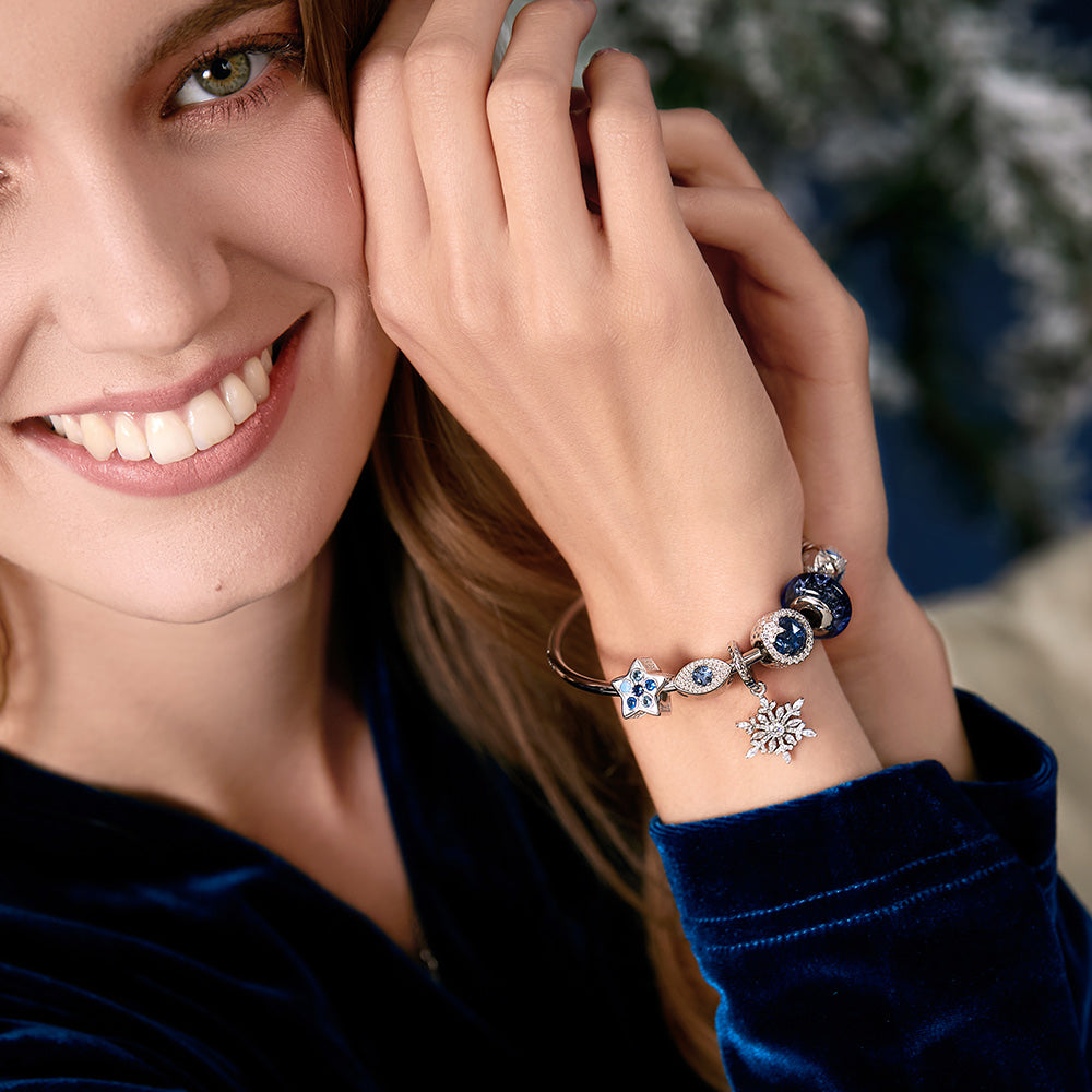 Crystal Snowflake pendant charm showcased on model wrist – 925 silver holiday jewelry style