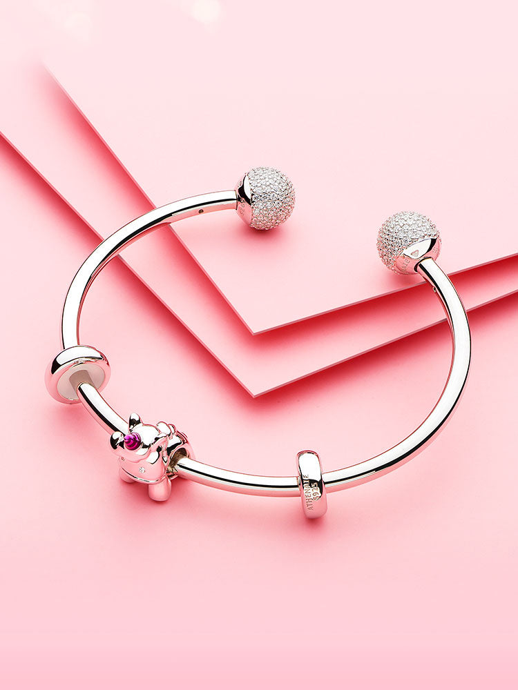 Cute unicorn charm styled on bracelet by ATHENAIE