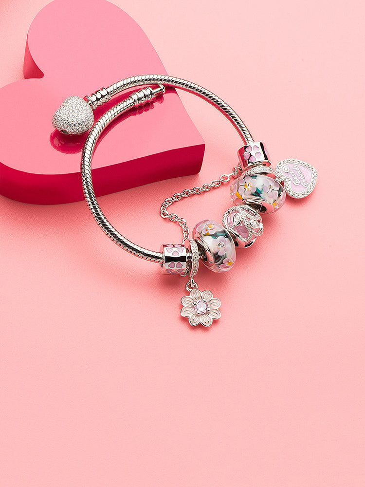 Daisy charm pendant styled on sterling silver charm bracelet