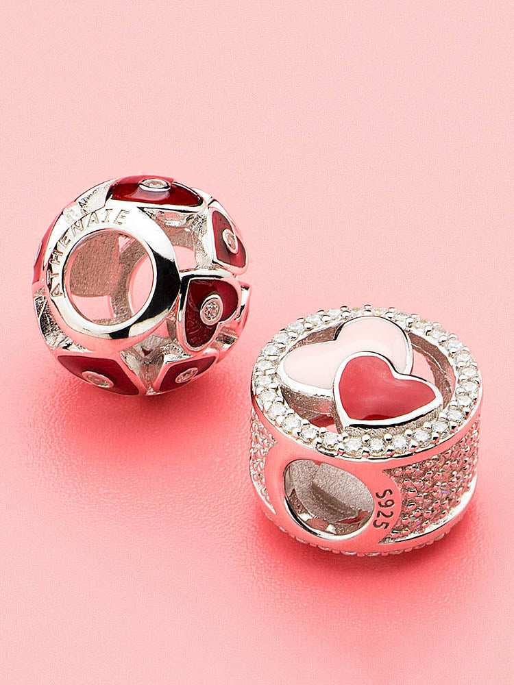 Twin Hearts charm bead displayed on bracelet with romantic heart theme