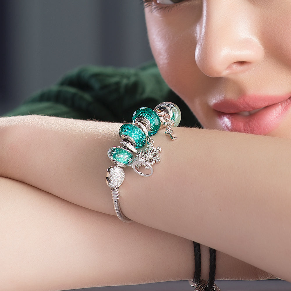 Model wearing Emerald Ice Murano glass charm bead bracelet.