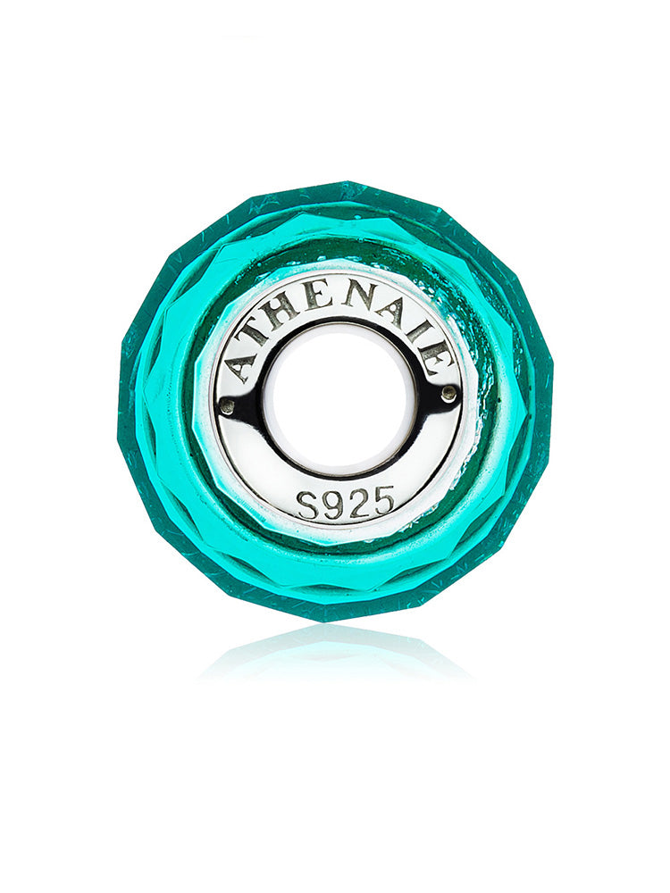Side view of emerald ice Murano glass charm bead with silver core