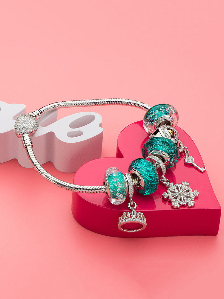 Emerald green Murano glass charm bead paired with sterling silver bracelet