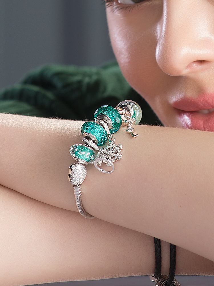 Emerald Murano glass charm bead worn on bracelet by model