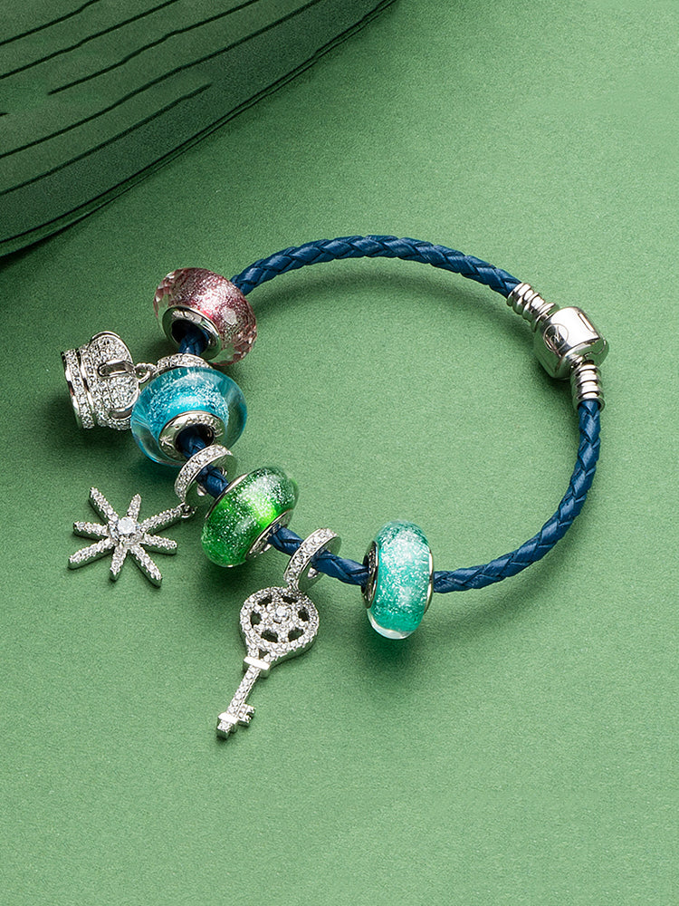 Emerald sky murano glass charm styled on silver charm bracelet