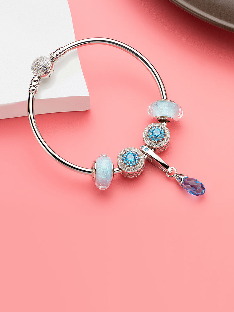 Ocean whisper Murano glass bead charm paired with silver bracelet by ATHENAIE